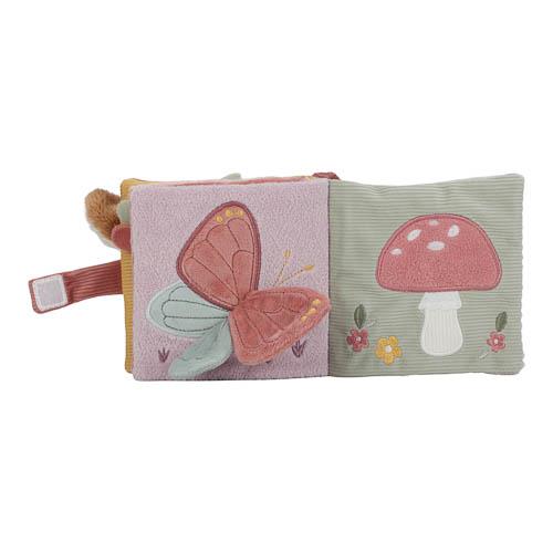 Bébé découvrant le livre pour poussette Fairy Garden