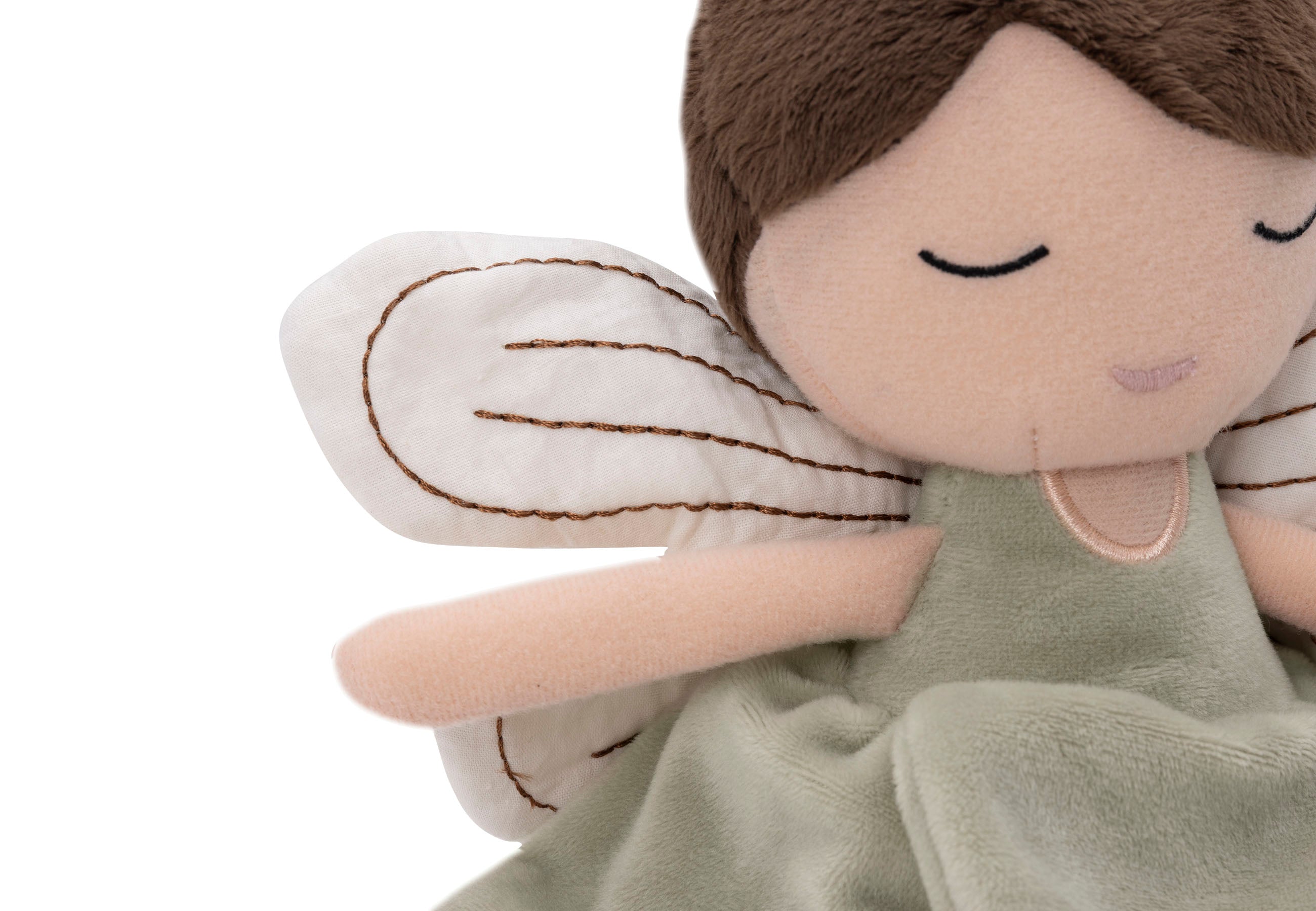 Enfant jouant avec la peluche fée Livia Jollein