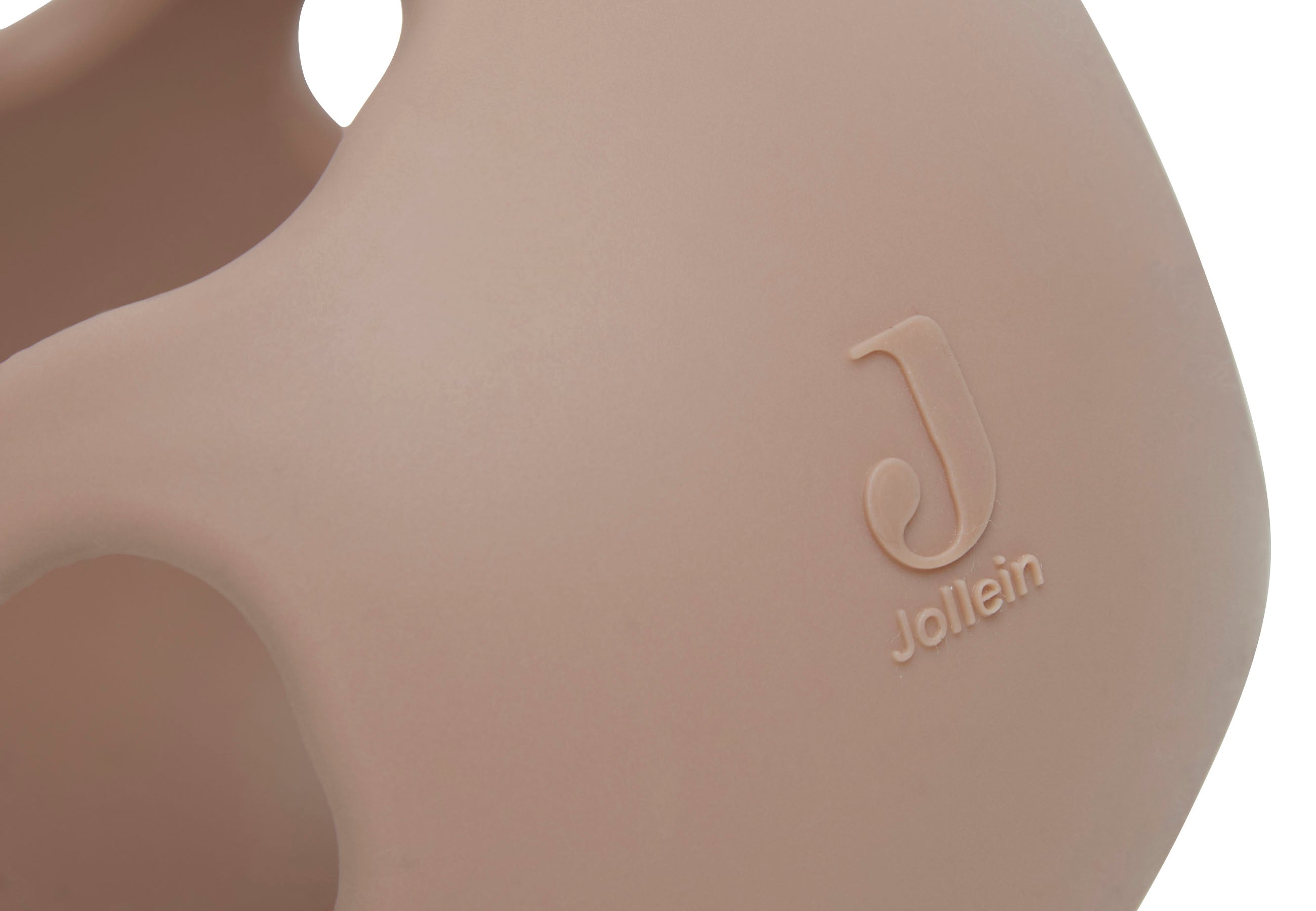 Balle de dentition en silicone biscuit Jollein tenue en main