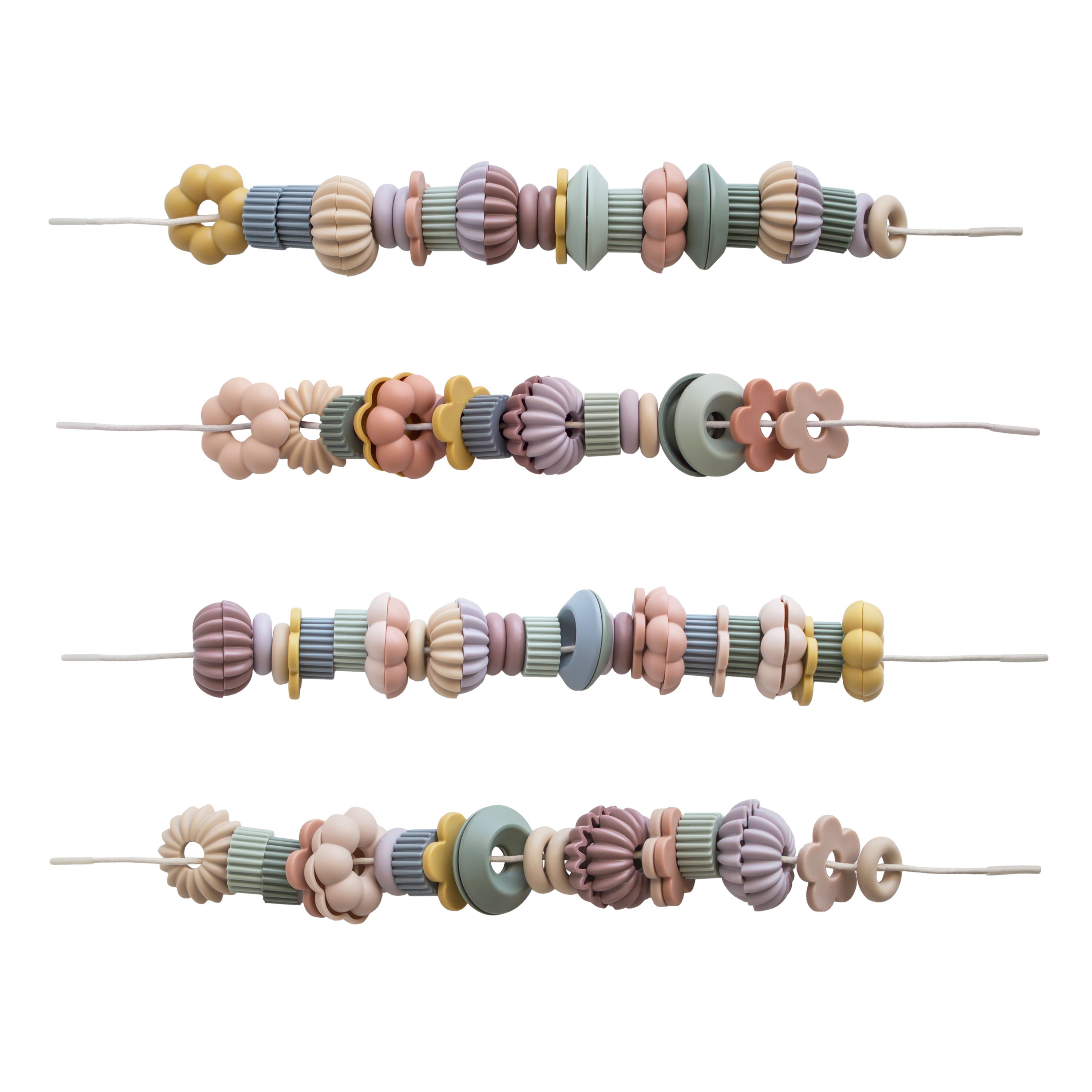 Jeu de laçage de perles Mushie avec quatre cordons et perles pastel