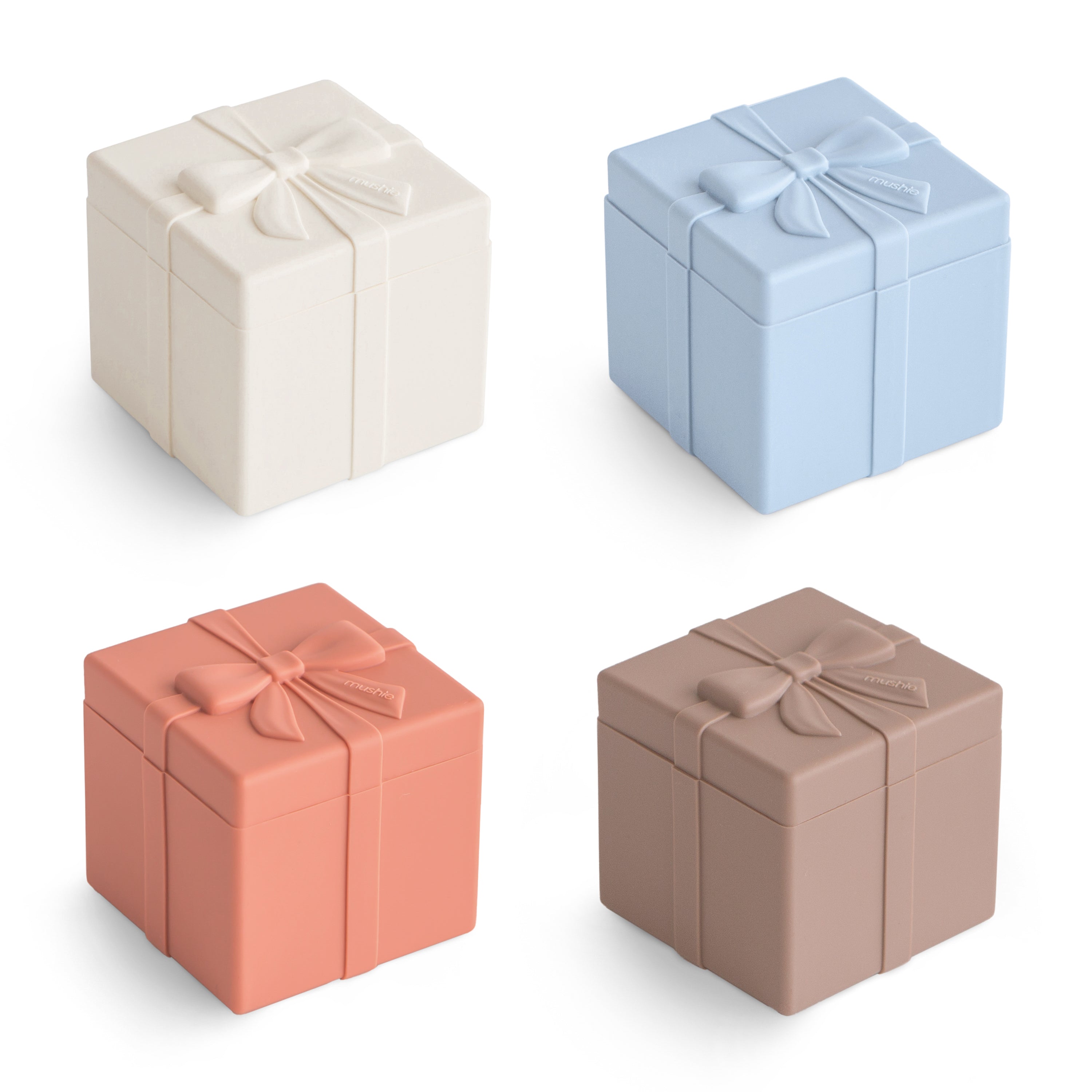Jeu à assortir Mushie Present avec quatre paquets cadeaux en silicone pastel