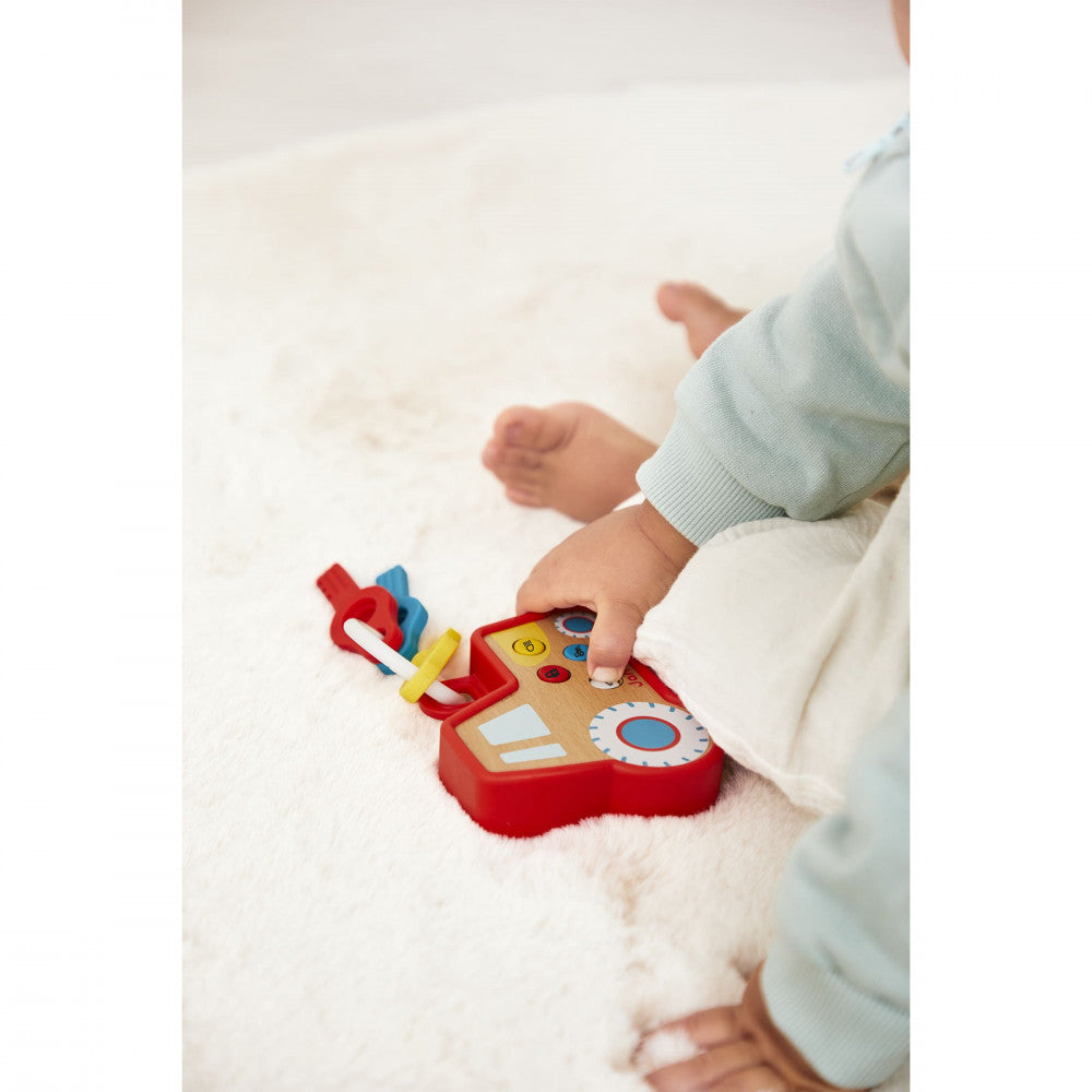 Porte-clés tracteur Janod avec ses clés pop-it colorées