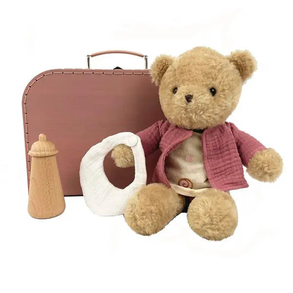 Morrissette l'ourse avec vêtements dans une valise