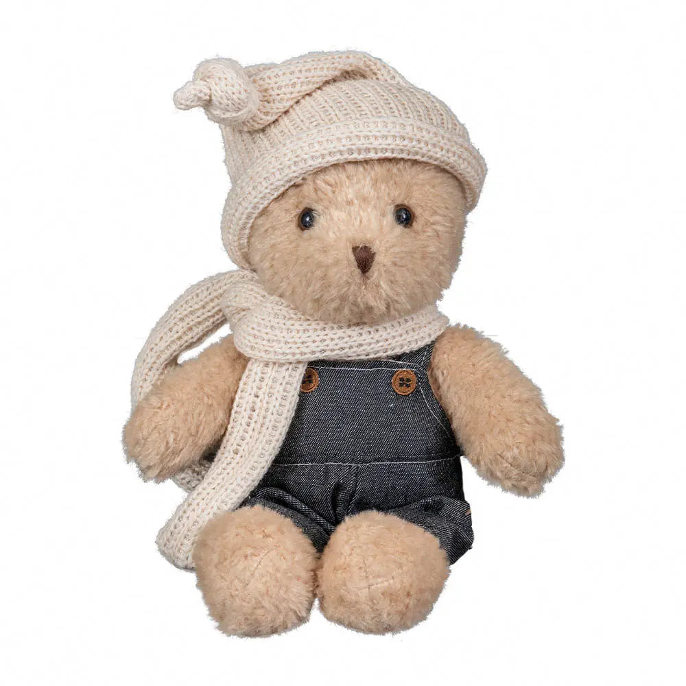 Morris l'ours avec vêtements dans une valise