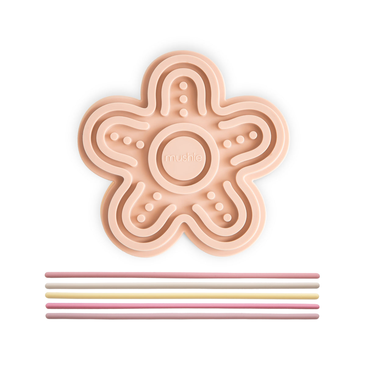 Jouet sensoriel en silicone Fleur Mushie, tapis pêche et cordons pastel